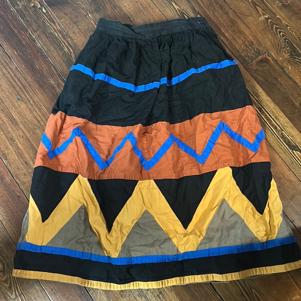 Vintage Claude Womens skirt. Size-6. Color-Black, Burnt orange, blue, yellow.